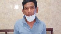 TERSANGKA Nyoman Jawi (57) pencuri kayu hutan lindung saat diamankan Polsek Rendang. Foto: ist TERSANGKA Nyoman Jawi (57) pencuri kayu hutan lindung saat diamankan Polsek Rendang. Foto: ist