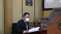 WAWAN Edi Prastiyo dalam sidang terbuka promosi Doktor Ilmu Hukum Program Studi Ilmu Hukum Universitas Udayana, pada Kamis (17/2/2022). Foto: ist WAWAN Edi Prastiyo dalam sidang terbuka promosi Doktor Ilmu Hukum Program Studi Ilmu Hukum Universitas Udayana, pada Kamis (17/2/2022). Foto: ist
