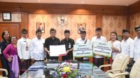 Jaya Negara Saksikan Penandatanganan Perjanjian Kerja Sama Antara Bank BPD Bali Dengan Desa Adat Sanur dan Desa Adat Intaran
